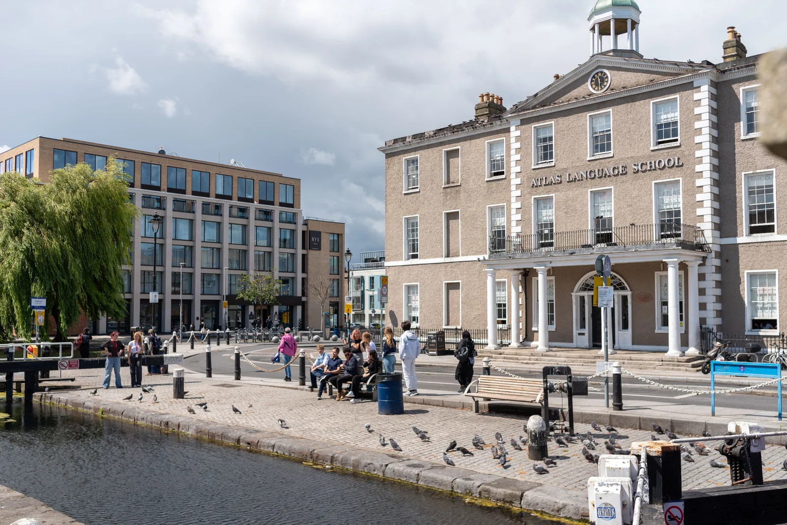 Exterior of the Atlas Dublin campus beside the canal