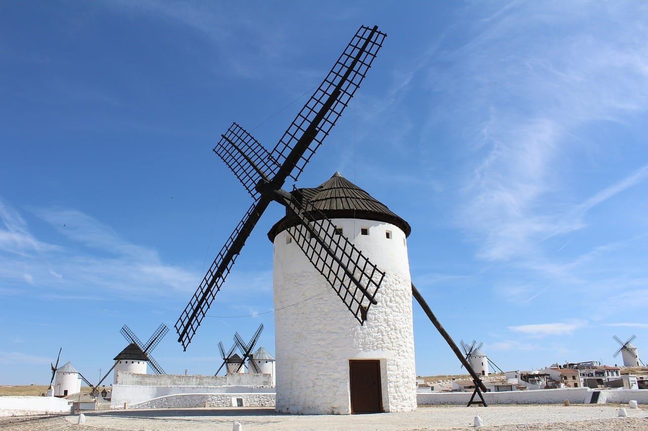 Windmills in Spain illustrating travel and cultural experiences while learning Spanish